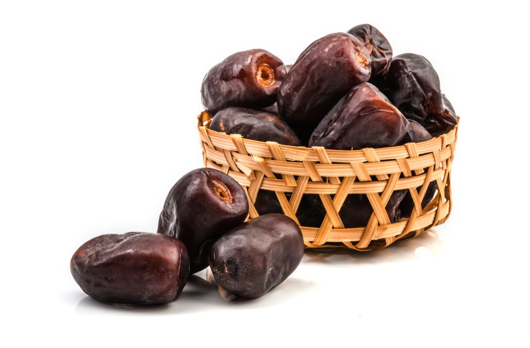 Dried split date (fruit of palm Phoenix dactylifera). Infinite depth of field, isolate on white backgroung.