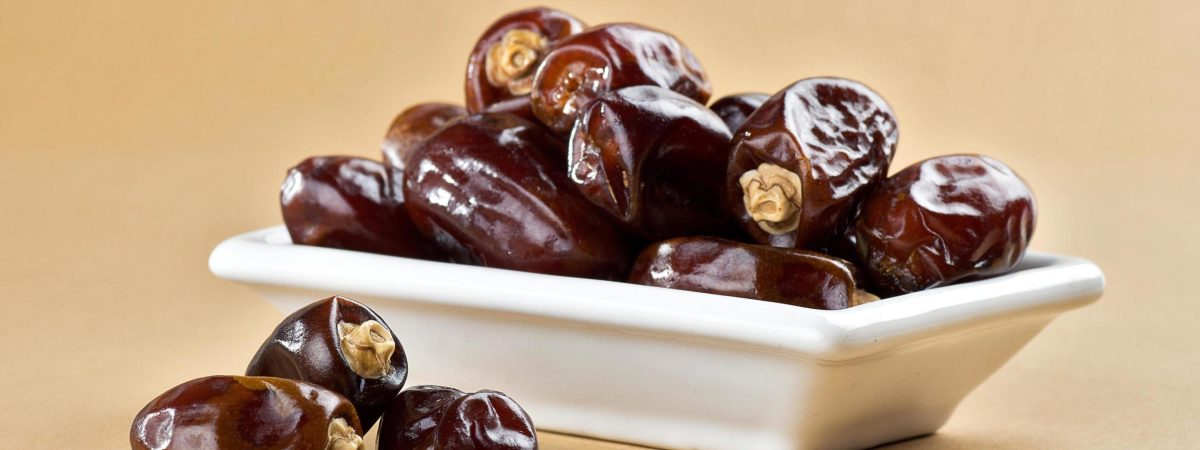 dried-dates-on-minimal-background-free-photo